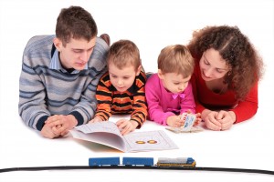 parents look books with children