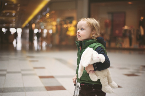 Young Child Looks Lost At A Mall